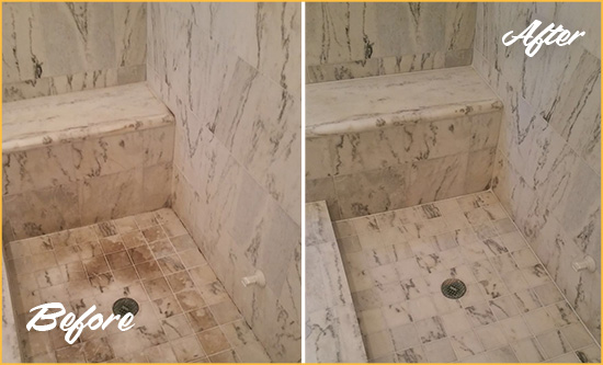 Before and After Picture of a Dirty Kennett Square Marble Shower Cleaned to Eliminate Dark Stains