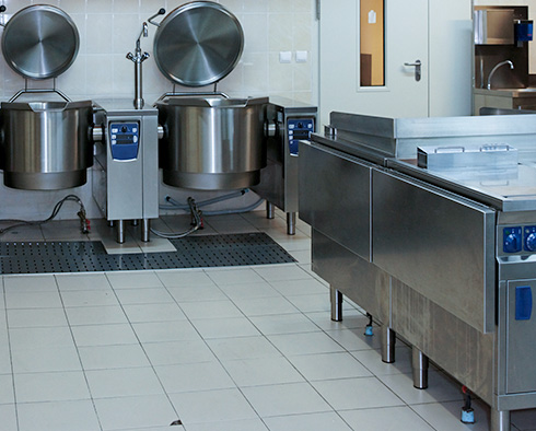 Tile and grout kitchen floor in a restaurant