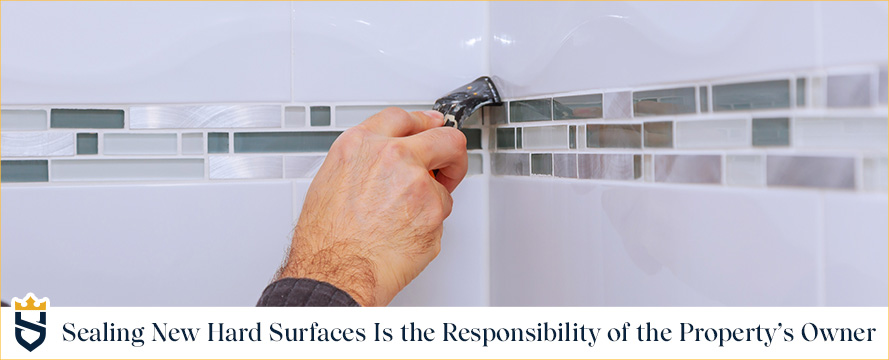 Homeowner Sealing His Hard Surface Shower Grout Lines Because Home Builder Don't Usually; It's Your Responsibility